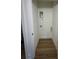 A narrow laundry room with wood-look flooring and utility connections at 803 Fargo Dr, Concord, NC 28027