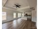 Open-concept living area with hardwood floors, modern fixtures, and abundant natural light at 803 Fargo Dr, Concord, NC 28027