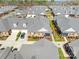 Aerial view of well-maintained brick townhomes with grey roofs and manicured lawns in a suburban community at 8439 Sonata Ct, Denver, NC 28037