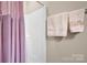 Clean bathroom featuring a white shower and a towel bar with neatly folded towels at 8439 Sonata Ct, Denver, NC 28037