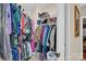 Walk in closet features organized storage and an expansive collection of clothing at 8439 Sonata Ct, Denver, NC 28037