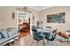 Dining room showcasing elegant decor, a table set for a meal, and a view into the living area at 8439 Sonata Ct, Denver, NC 28037
