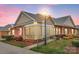 Charming brick home featuring a screened porch, manicured landscaping, and an American flag display at 8439 Sonata Ct, Denver, NC 28037