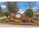 Elegant brick neighborhood sign with lush landscaping, creating a welcoming entrance at 8439 Sonata Ct, Denver, NC 28037