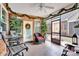 Inviting screened-in porch with comfortable seating, decorative plants, and stylish tile flooring at 8439 Sonata Ct, Denver, NC 28037