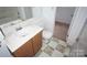 Modest bathroom with a single sink vanity, and a toilet at 8915 Touchstone Ln, Charlotte, NC 28227