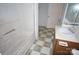 Bathroom featuring a tub, vanity, and door to another room at 8915 Touchstone Ln, Charlotte, NC 28227