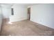 Bedroom featuring neutral paint, carpet, and a closet at 8915 Touchstone Ln, Charlotte, NC 28227