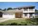 Charming two-story home with a two-car garage and well-maintained lawn at 8915 Touchstone Ln, Charlotte, NC 28227