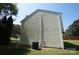 Side view of home's exterior with vinyl siding and central air conditioning unit at 8915 Touchstone Ln, Charlotte, NC 28227