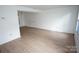 Bright living room featuring wood-look floors and lots of natural light at 8915 Touchstone Ln, Charlotte, NC 28227