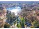 Aerial view showcases waterfront homes, lush trees, and serene lake views, perfect for nature lovers at 110 Hazelton Loop, Mooresville, NC 28117