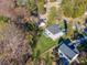 An aerial view highlighting a well-maintained yard, neighborhood homes, and mature trees at 110 Hazelton Loop, Mooresville, NC 28117