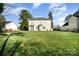 Sprawling backyard with lush green lawn, shade trees, and exterior view of the home at 110 Hazelton Loop, Mooresville, NC 28117