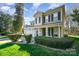 Attractive two-story home with a manicured front yard, complemented by a long driveway and two-car garage at 110 Hazelton Loop, Mooresville, NC 28117