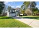 Well-maintained home with a two-car garage, lush lawn, and manicured landscaping, creating curb appeal at 110 Hazelton Loop, Mooresville, NC 28117