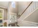Inviting foyer with hardwood floors, staircase, and ample natural light, creating a warm welcome at 110 Hazelton Loop, Mooresville, NC 28117