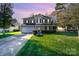 Charming two-story home with manicured lawn and inviting entrance, complemented by a spacious driveway at 110 Hazelton Loop, Mooresville, NC 28117