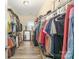Large walk-in closet with shelves, hanging rods, and storage solutions for clothing and accessories at 110 Hazelton Loop, Mooresville, NC 28117