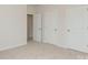 Carpeted bedroom featuring three doors at 1101 Red River Dr, Salisbury, NC 28144