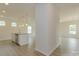 Open-concept kitchen and living space with white cabinets, stainless appliances, and hardwood floors at 1101 Red River Dr, Salisbury, NC 28144