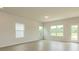Bright living room with neutral walls, wood-look floors and access to the backyard at 1101 Red River Dr, Salisbury, NC 28144