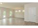 Bright living space with hardwood floors, fresh paint, modern ceiling fixture, and outdoor access at 1101 Red River Dr, Salisbury, NC 28144
