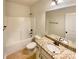 Full bathroom featuring granite vanity, large mirror, and tub/shower combo at 11123 River Oaks Nw Dr, Concord, NC 28027