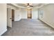 Spacious bedroom with tray ceiling, neutral carpet, and plenty of natural light at 11123 River Oaks Nw Dr, Concord, NC 28027