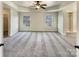Main bedroom with a tray ceiling, a ceiling fan, and a walk-in closet at 11123 River Oaks Nw Dr, Concord, NC 28027