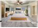 Main bedroom with a tray ceiling, a ceiling fan, and a walk-in closet at 11123 River Oaks Nw Dr, Concord, NC 28027