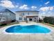 Backyard featuring an in-ground pool with concrete surround and a pergola at 11123 River Oaks Nw Dr, Concord, NC 28027
