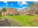 A large fenced-in backyard offers a wooden deck and green lawn at 1116 Berry Ridge Rd, Charlotte, NC 28270