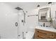 Modern bathroom featuring a glass-enclosed shower, updated fixtures, and wooden vanity at 1116 Berry Ridge Rd, Charlotte, NC 28270