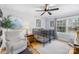 Bright Bedroom with a white crib, hardwood floors, and a comfortable reading chair at 1116 Berry Ridge Rd, Charlotte, NC 28270