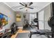 Functional home gym with exercise equipment, rubber flooring, and a wall-mounted TV at 1116 Berry Ridge Rd, Charlotte, NC 28270