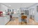 Modern kitchen with white cabinets, stainless steel appliances, granite countertops, and a kitchen island at 1116 Berry Ridge Rd, Charlotte, NC 28270