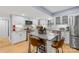 Bright kitchen with white cabinets, stainless steel appliances, granite counters, and a center island at 1116 Berry Ridge Rd, Charlotte, NC 28270