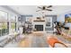 Inviting living room with a brick fireplace and hardwood flooring, perfect for work and play at 1116 Berry Ridge Rd, Charlotte, NC 28270