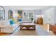 Comfortable living room with a sectional sofa, hardwood floors, and natural light at 1116 Berry Ridge Rd, Charlotte, NC 28270
