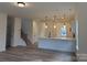 Open-concept living area showcasing wood floors, a kitchen view, and ample natural light at 1120 Red River Rd, Salisbury, NC 28144