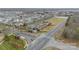 Aerial community view featuring a horse stable, pasture, and surrounding neighborhood at 1122 Saratoga Blvd, Indian Trail, NC 28079