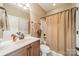 Bathroom with vanity, sink, toilet and shower-tub with curtain. Tile floor and neutral wall color at 1122 Saratoga Blvd, Indian Trail, NC 28079