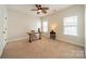 Bedroom with neutral walls and carpet, two windows with blinds, and a ceiling fan at 1122 Saratoga Blvd, Indian Trail, NC 28079