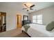 Comfortable bedroom featuring ceiling fan, carpeted floors, and natural light at 1122 Saratoga Blvd, Indian Trail, NC 28079