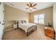 Cozy bedroom with neutral walls, ceiling fan, and large window with blinds. Chest and nightstand included at 1122 Saratoga Blvd, Indian Trail, NC 28079