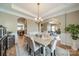 Spacious dining room featuring hardwood floors and an open layout leading to kitchen and living areas at 1122 Saratoga Blvd, Indian Trail, NC 28079
