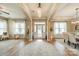 Inviting foyer featuring wood floors, elegant lighting, and an open floor plan leading to the dining area at 1122 Saratoga Blvd, Indian Trail, NC 28079