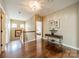 Upstairs hallway featuring gleaming hardwood floors and a decorative console table at 1122 Saratoga Blvd, Indian Trail, NC 28079