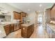 Well-lit kitchen featuring stainless steel appliances and a granite island at 1122 Saratoga Blvd, Indian Trail, NC 28079